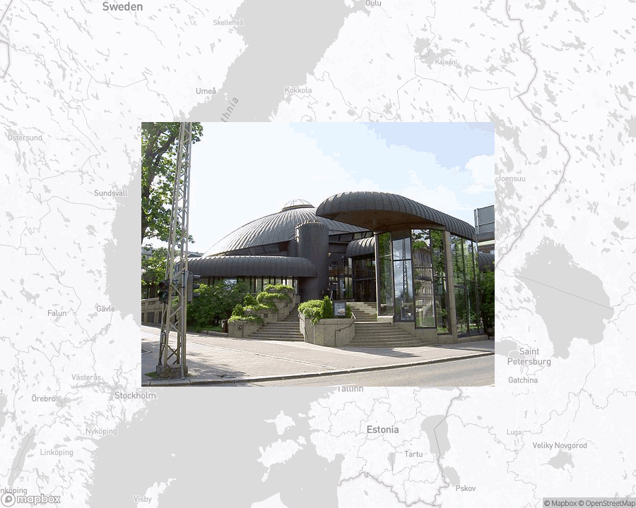 A photo of or from a library from the linked website, overlaid on a cropped world map where it's located.