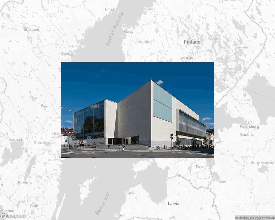 A photo of or from a library from the linked website, overlaid on a cropped world map where it's located.