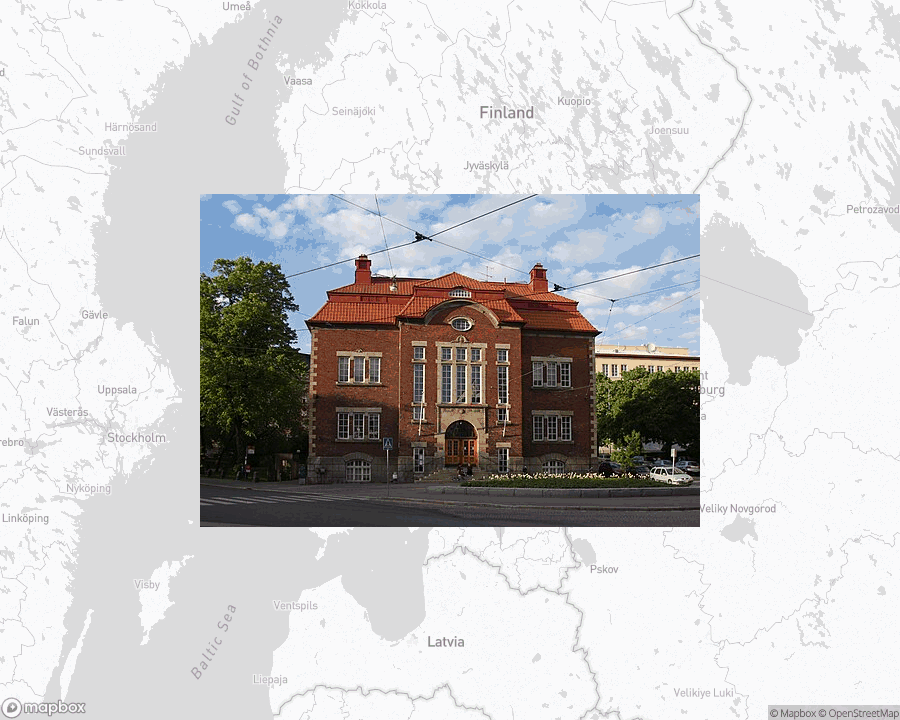 A photo of or from a library from the linked website, overlaid on a cropped world map where it's located.